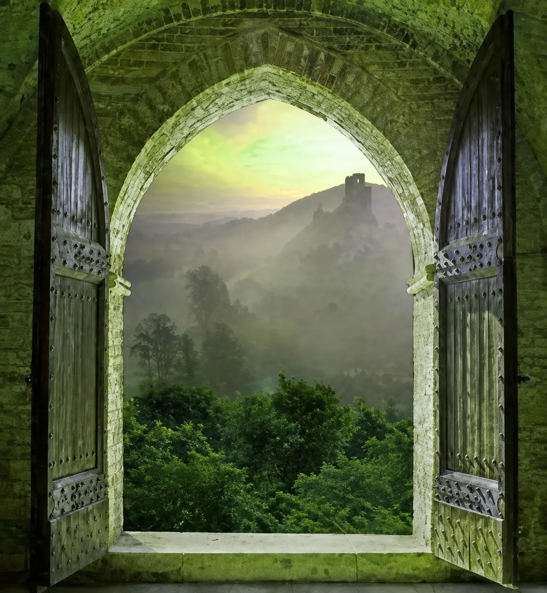 An old stone doorway opening onto a green valley and distant castle, an illustration accompanying the exploration of wisdom traditions and Mystery Schools