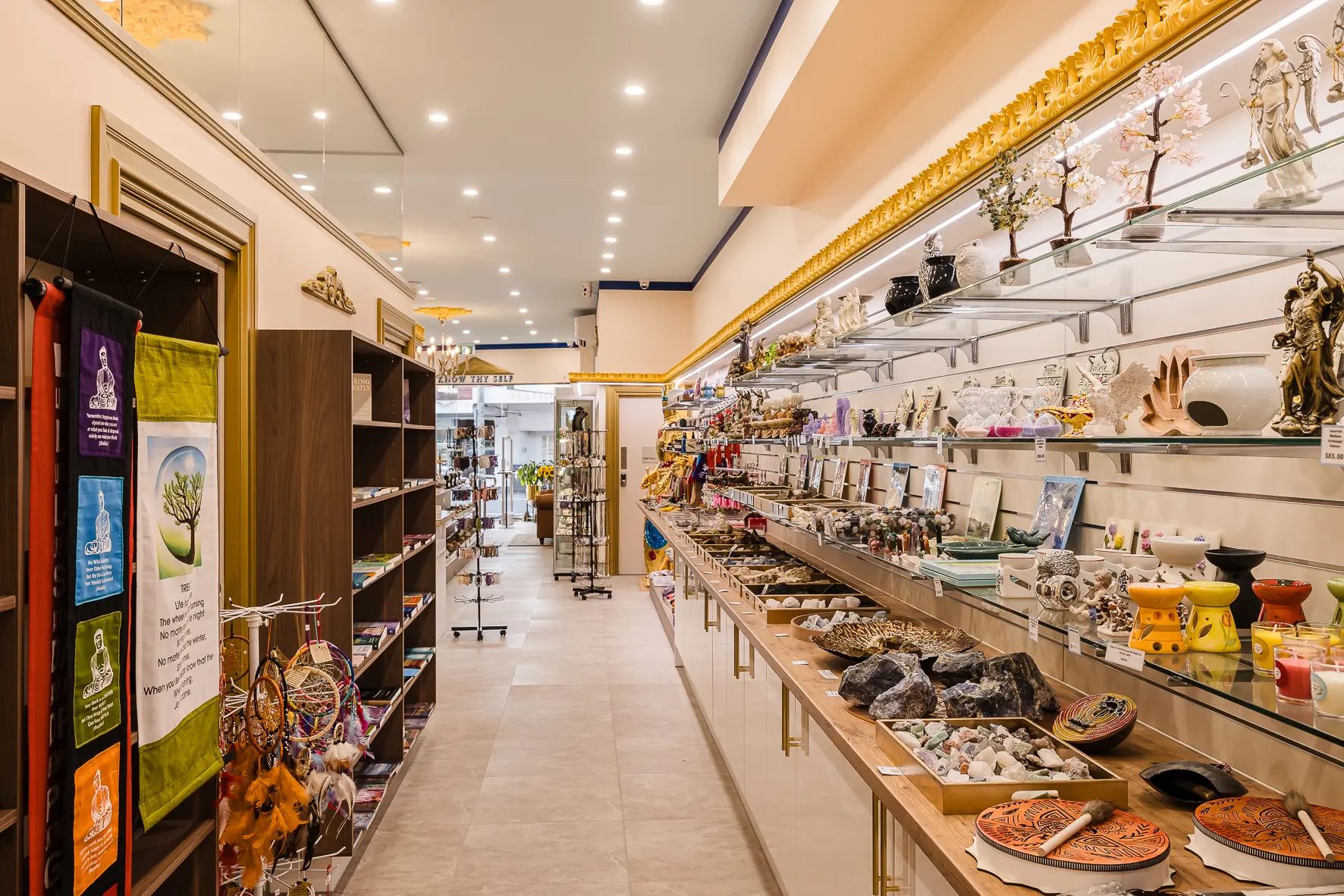 Books, candles, oil burners, dreamcatchers and gifts on the display shelves of the Atlantis Centre Crystal Gift Shop