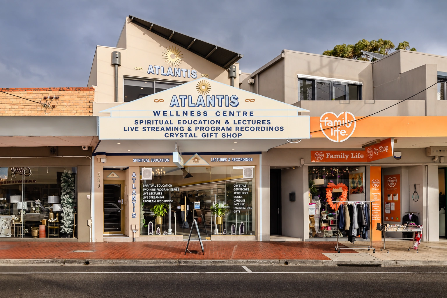 Streetfront at 599 Balcombe Road with signage for spiritual education, lectures, live streaming, program recordings and the Crystal Gift Shop